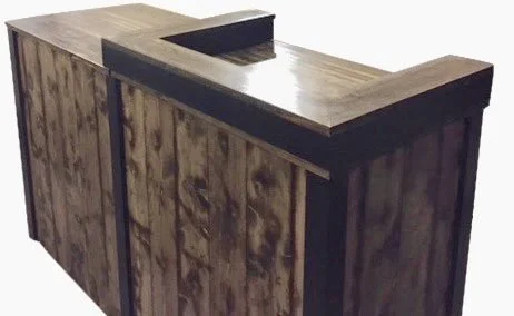 Dark torched wood sales desk with black trim