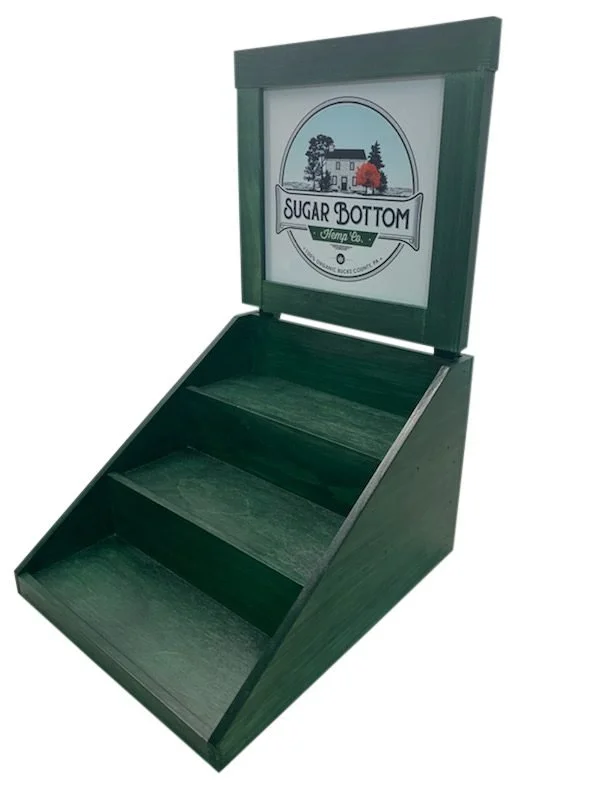 Green stained three-tier countertop display with framed color sign