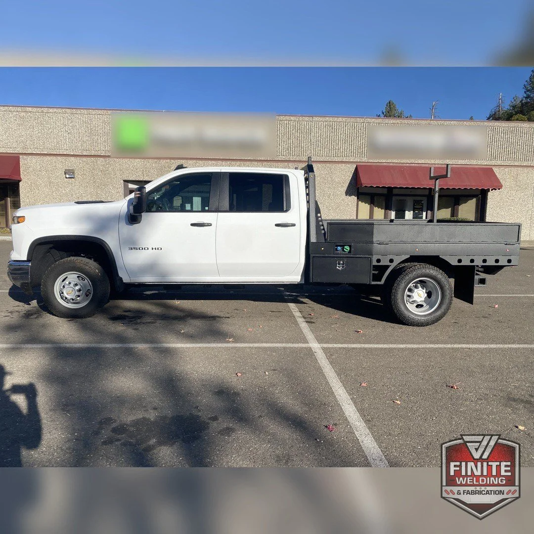 2026 Chevy Silverado 3500 dually side profile with wood deck flatbed