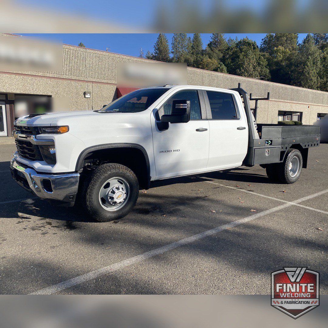 2026 Chevy Silverado 3500 dually wood deck flatbed, front quarter view