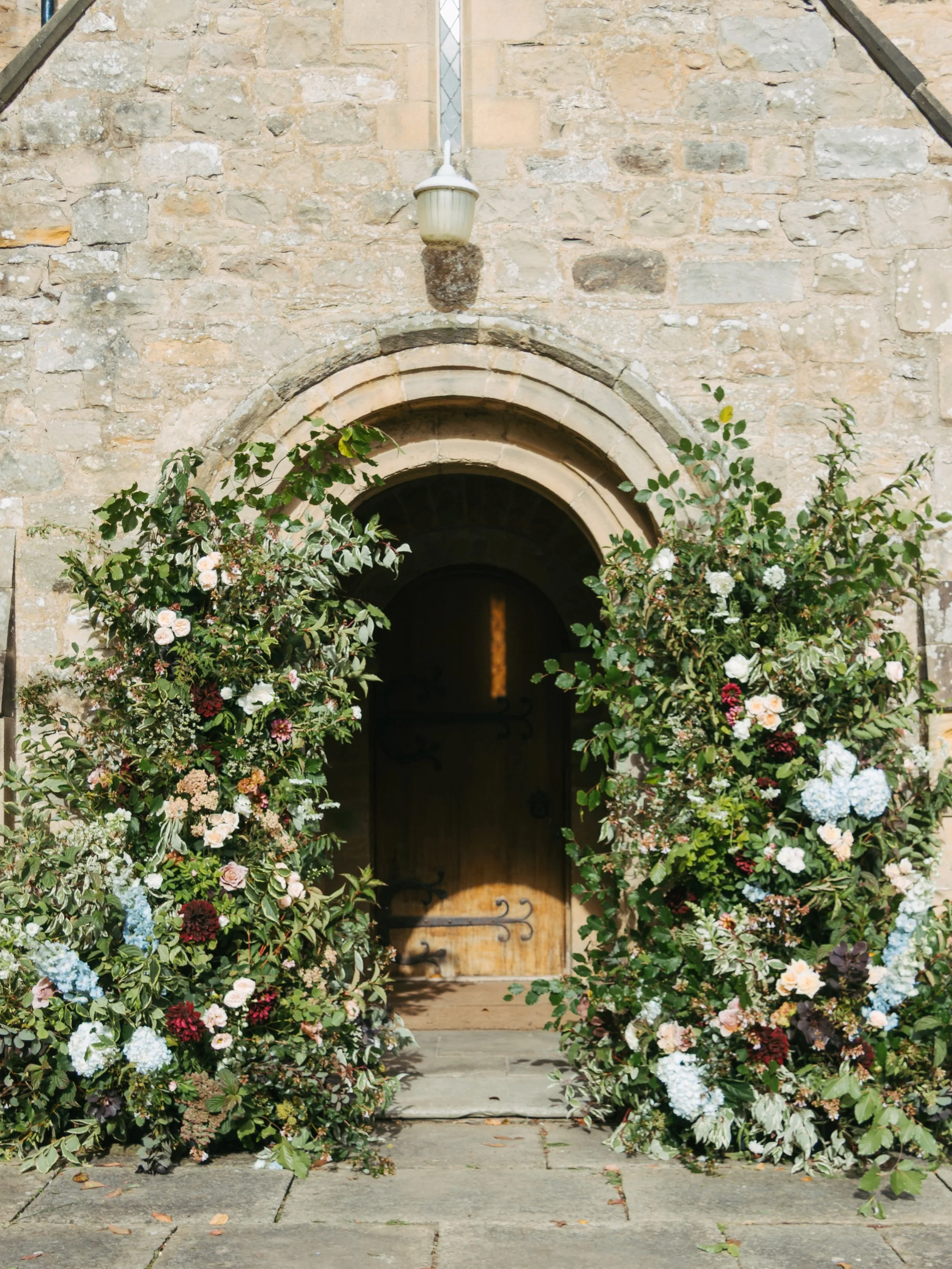 I&rsquo;ll never tire of creating broken archways, especially for a church entrance. They go so perfectly together.

All of our installations are filled with British-grown foliage, which means no two are ever the same, and they look completely differ