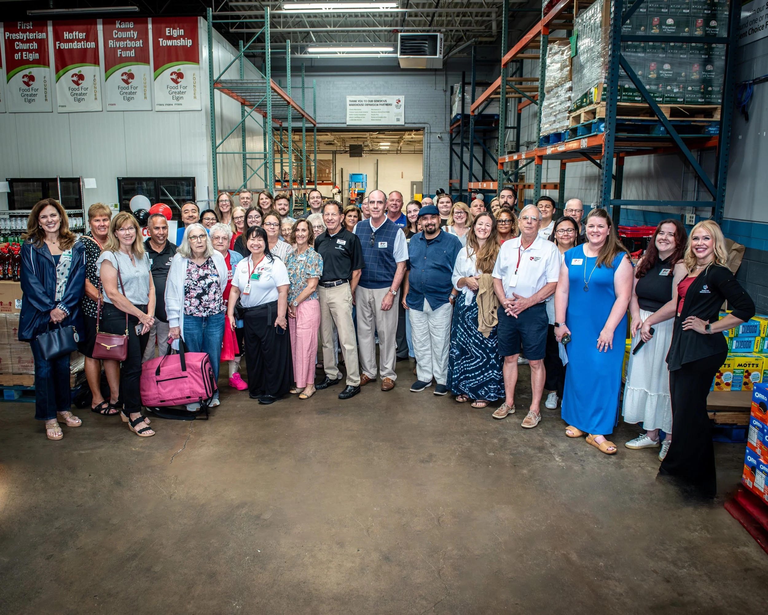 Group of Food for Greater Elgin staff and volunteers celebrating our impact in 2026