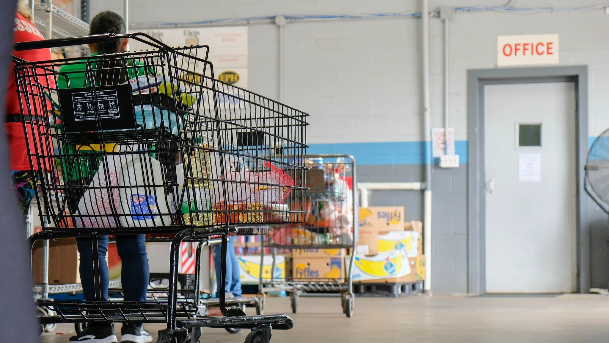 Guests shopping at Food for Greater Elgin for groceries.