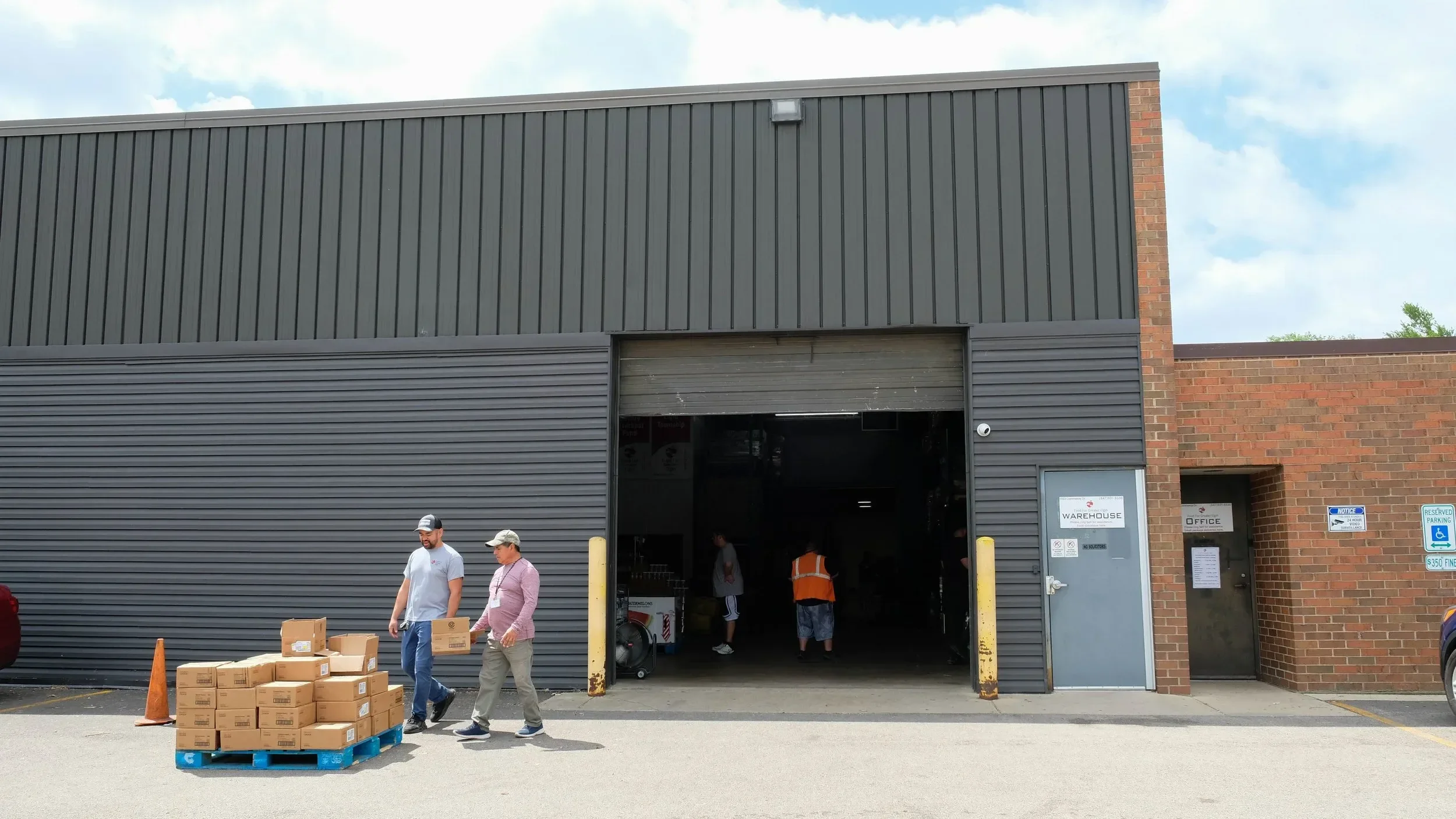 Guest leaving Food for Greater Elgin's food pantry after a distribution.