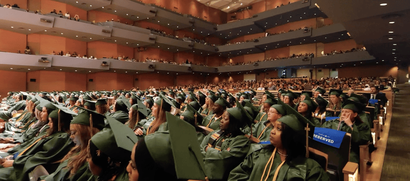 Rasmussen Minnesota graduates in the crowd at commencement.