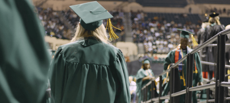 Rasmussen Florida graduates walking during ceremony.