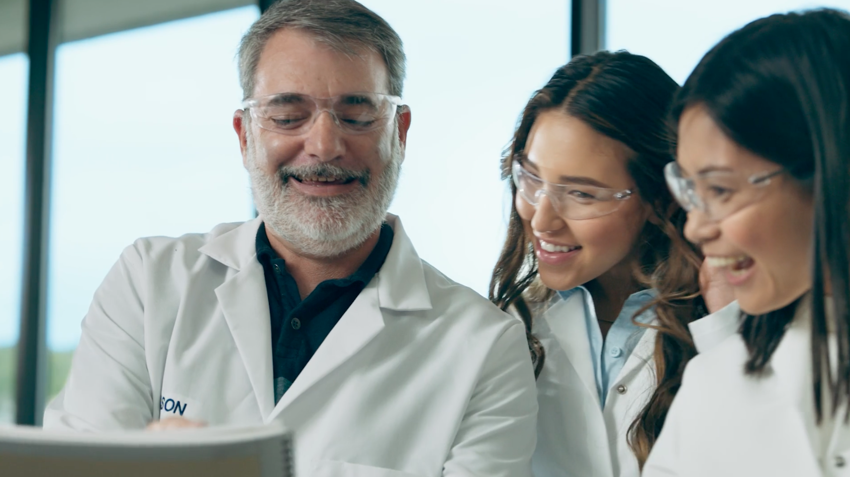 Amway scientists reviewing the Traceability Tool.