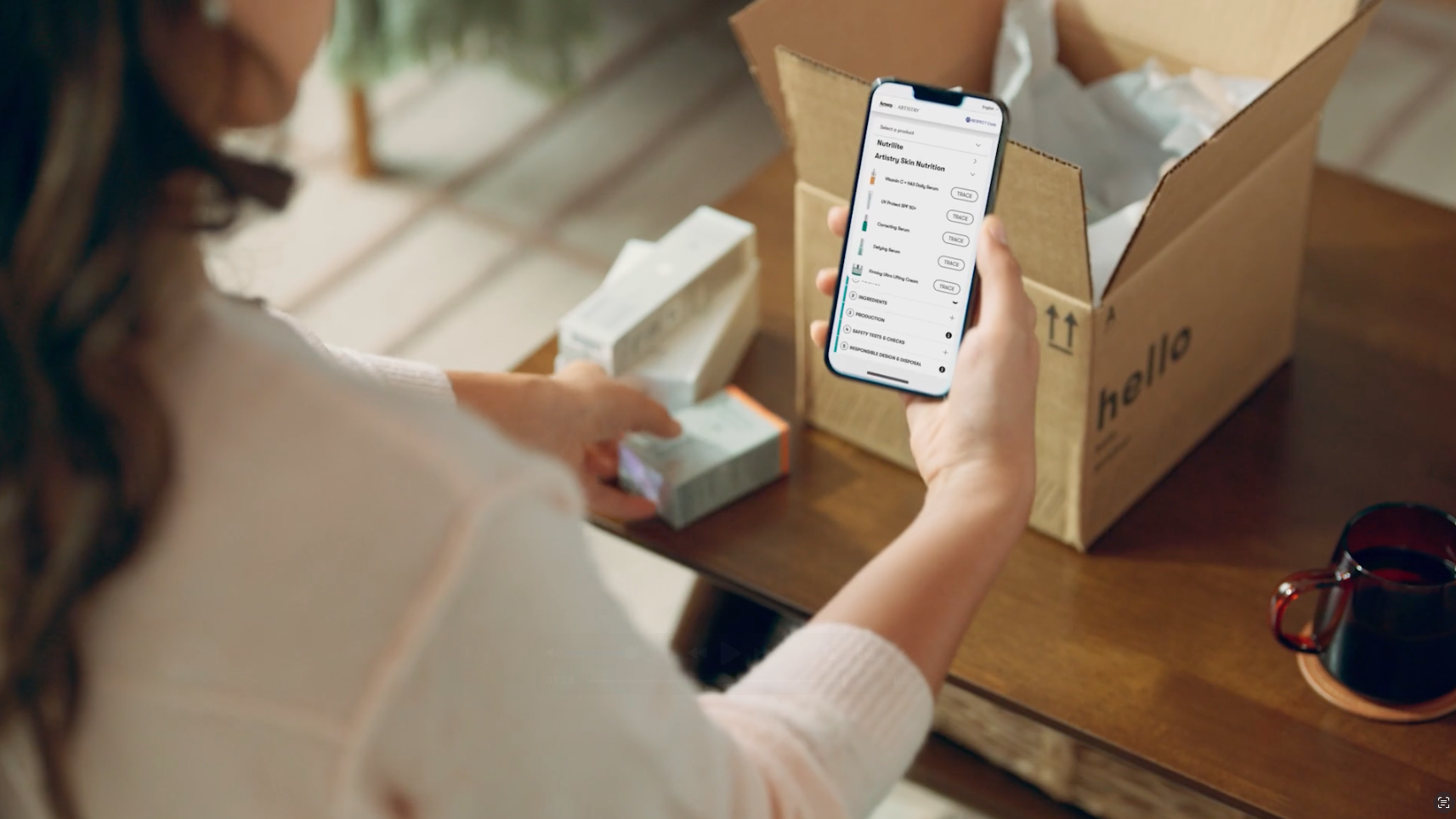 Woman viewing the Amway Tracing Tool on her phone.