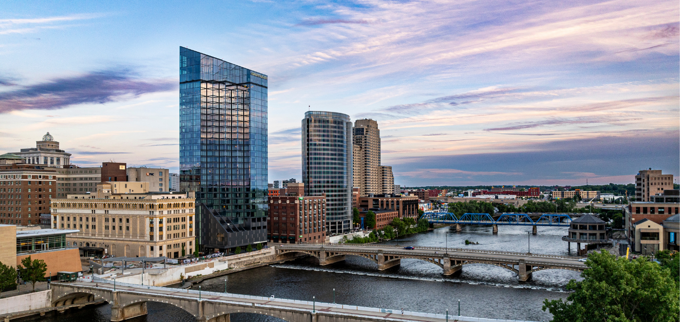 Aerial view of downtown Grand Rapids featuring the river, Blue Bridge, and Amway Grand Plaza.