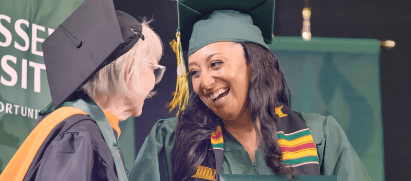 Rasmussen Illinois graduates happy at 2025 commencement ceremony.