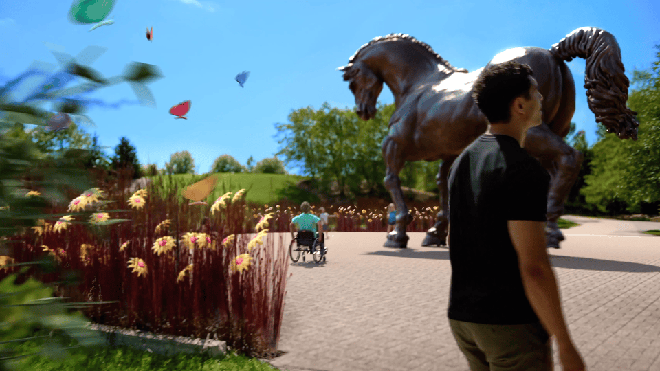 Animated GIF showing a large bronze horse sculpture lowering from its hind legs before transitioning to a close-up of local craft beer being poured into a glass.