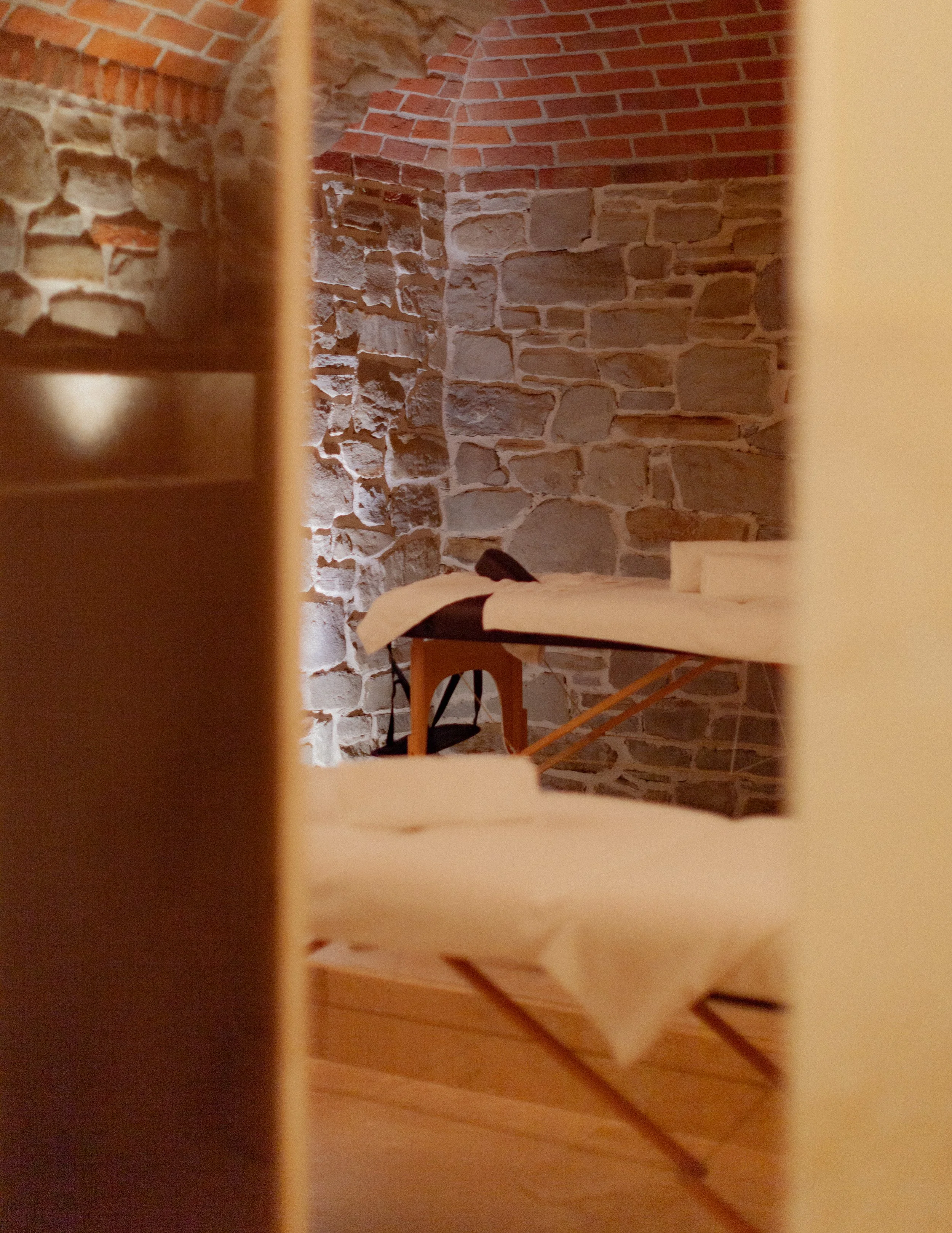 hotel treatment room with old brickwork