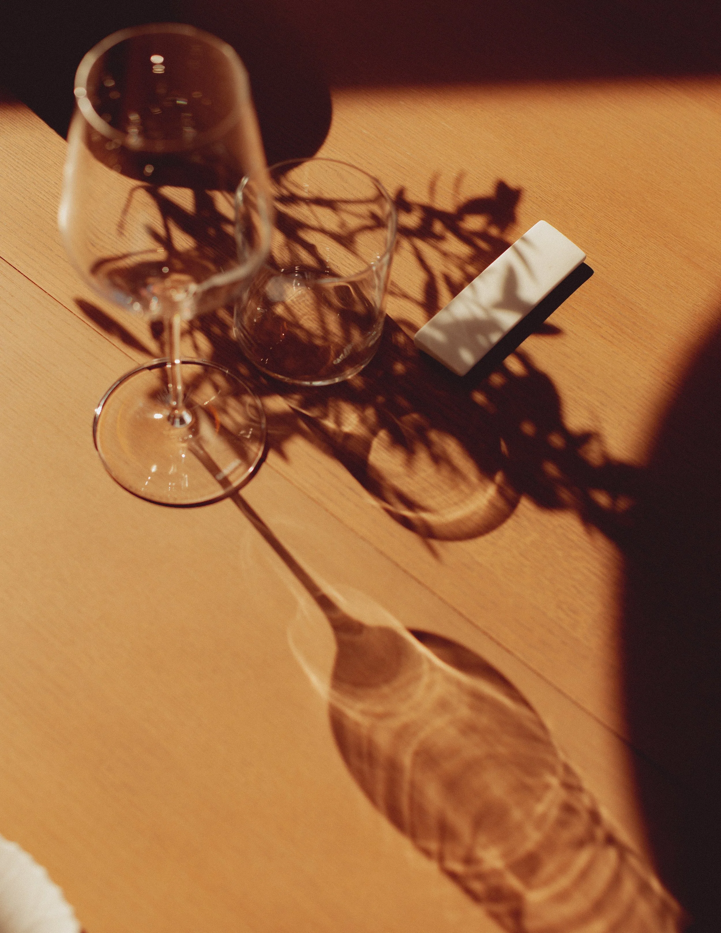 shadows of glassware on a table