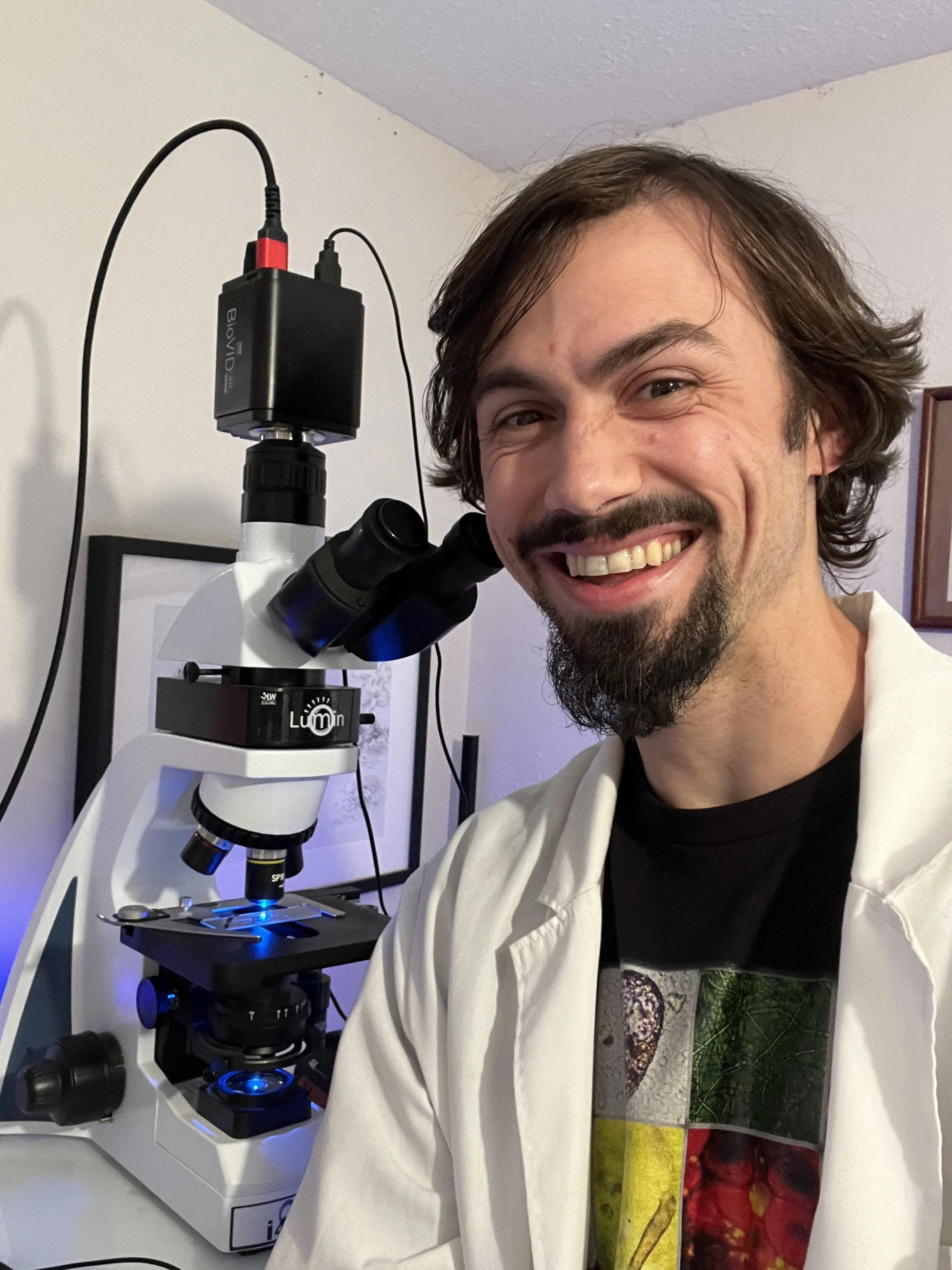Matt Powers, author of Regenerative Soil, with his microscope