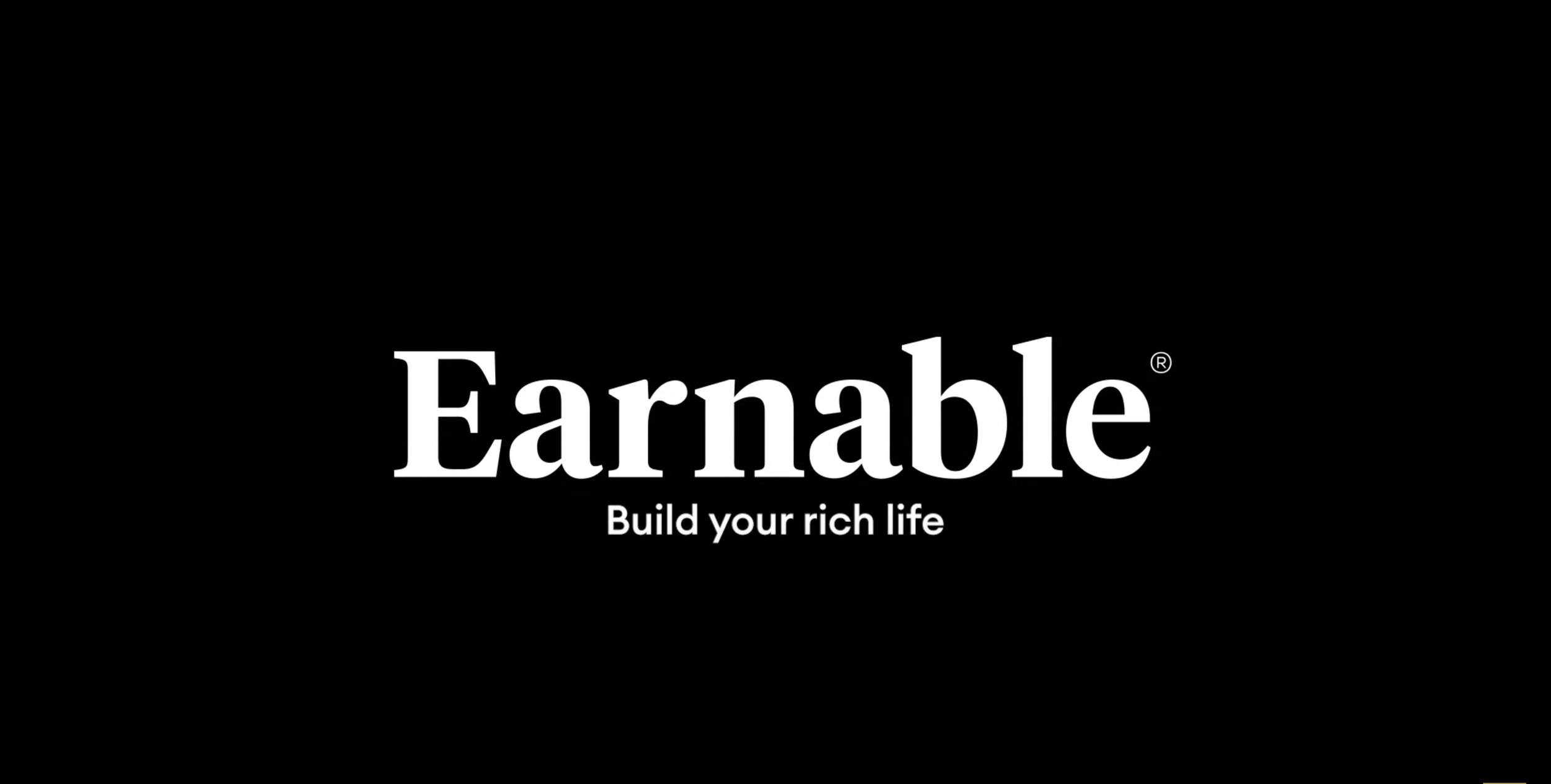 Black background with the white text 'Earnable' and the tagline 'Build your rich life' underneath.