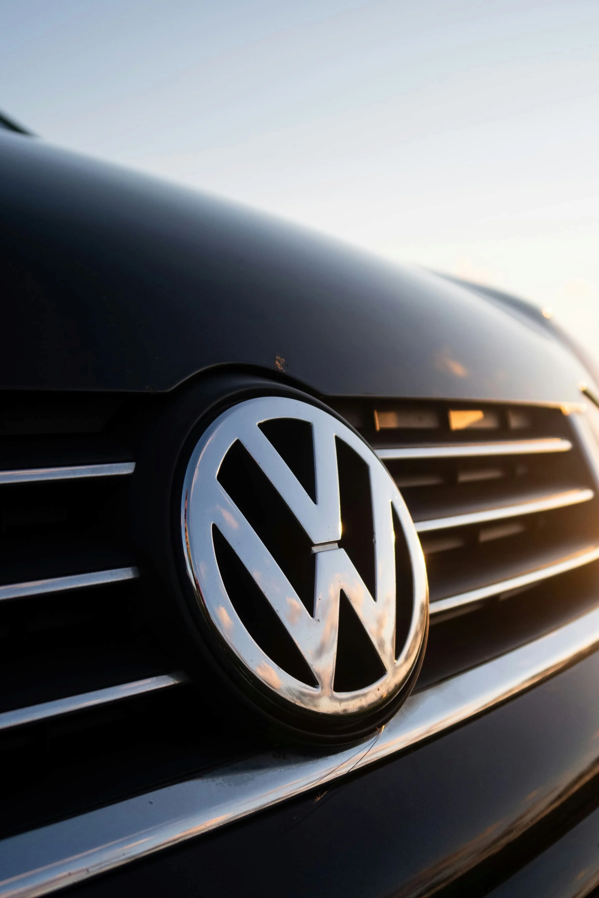 Close-up of Volkswagen front badge representing larger van platforms like the VW Crafter used for spacious touring campervans | which VW campervan size is right for you | Cornwall