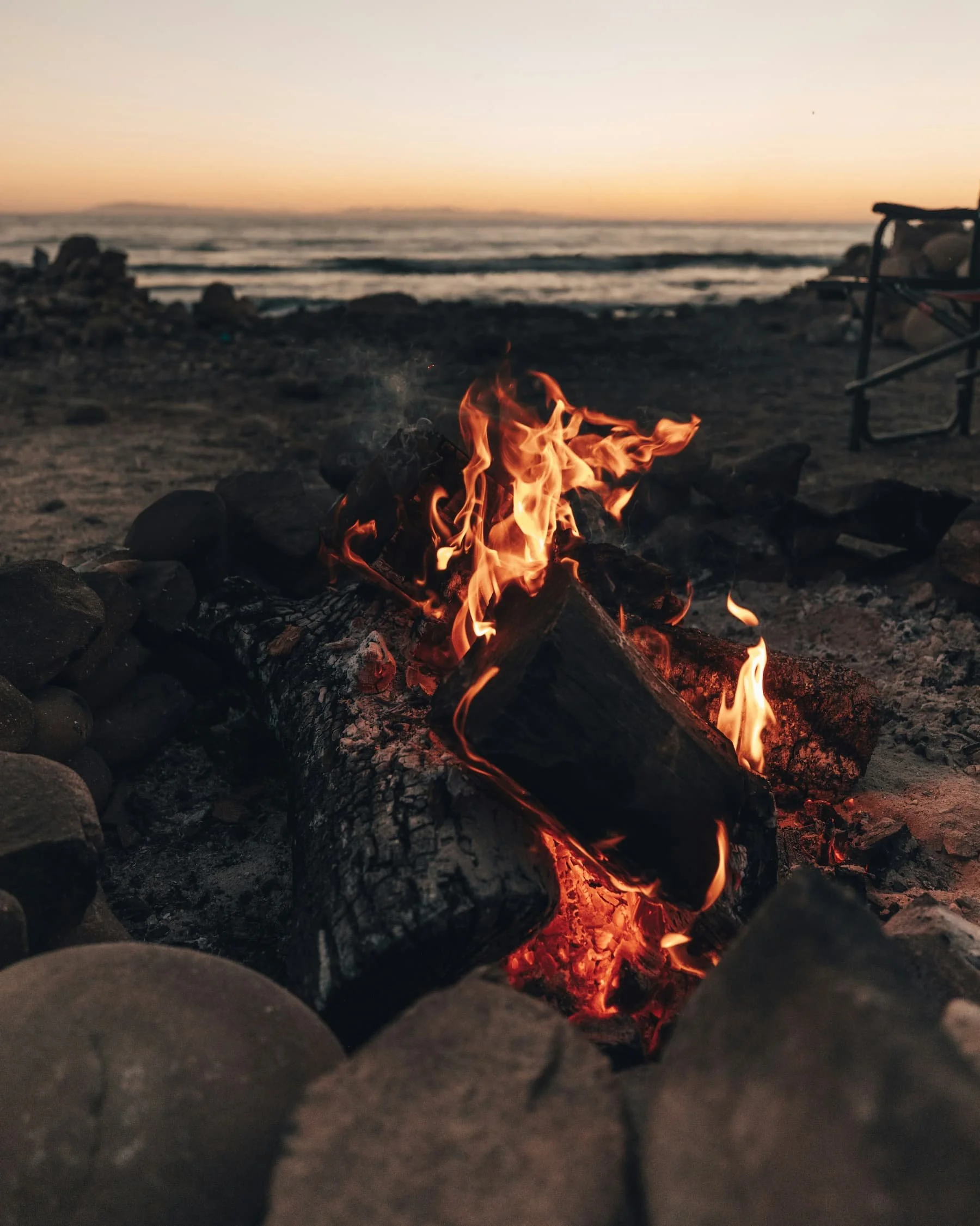 Firepit on the beach at sunset | off-grid living | Cornwall