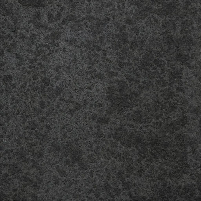 Close-up of a dark grey textured stone surface.