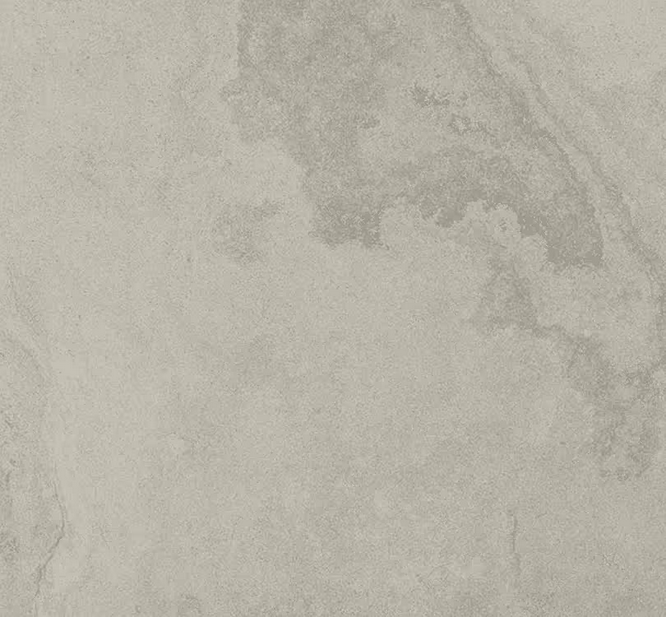 Close-up of a textured, light gray concrete surface with subtle darker gray patterns.