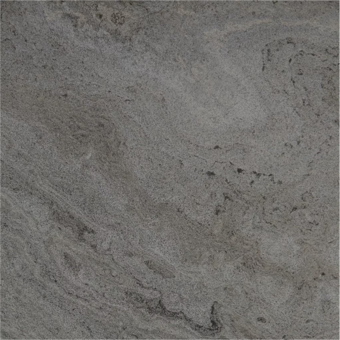 Close-up of a textured gray stone or concrete surface with natural patterns.