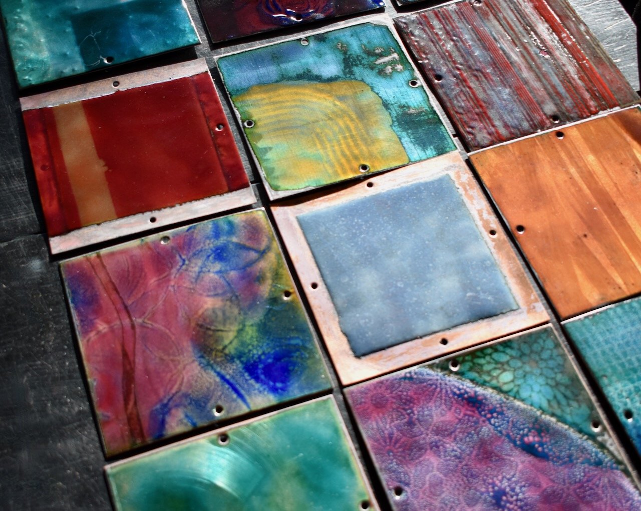 Metal Mosaic enameled tiles awaiting assembly