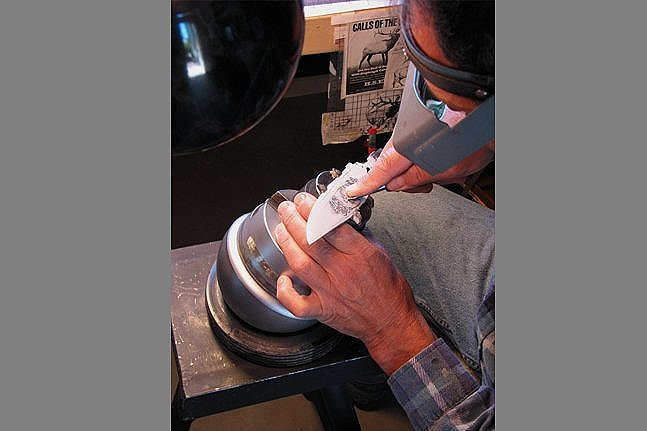 Engraving the elk using small pneumatic chisel