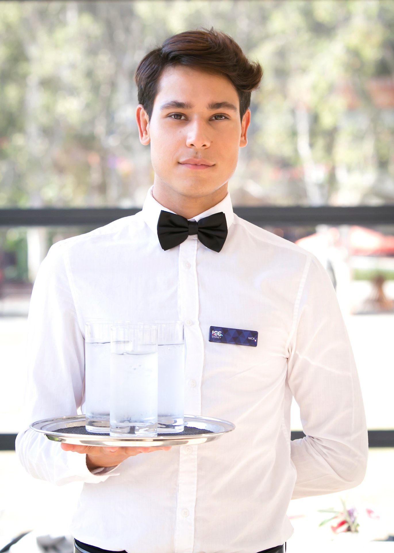  male waiter holding drinks tray ICC Sydney kirsten cox photography events 