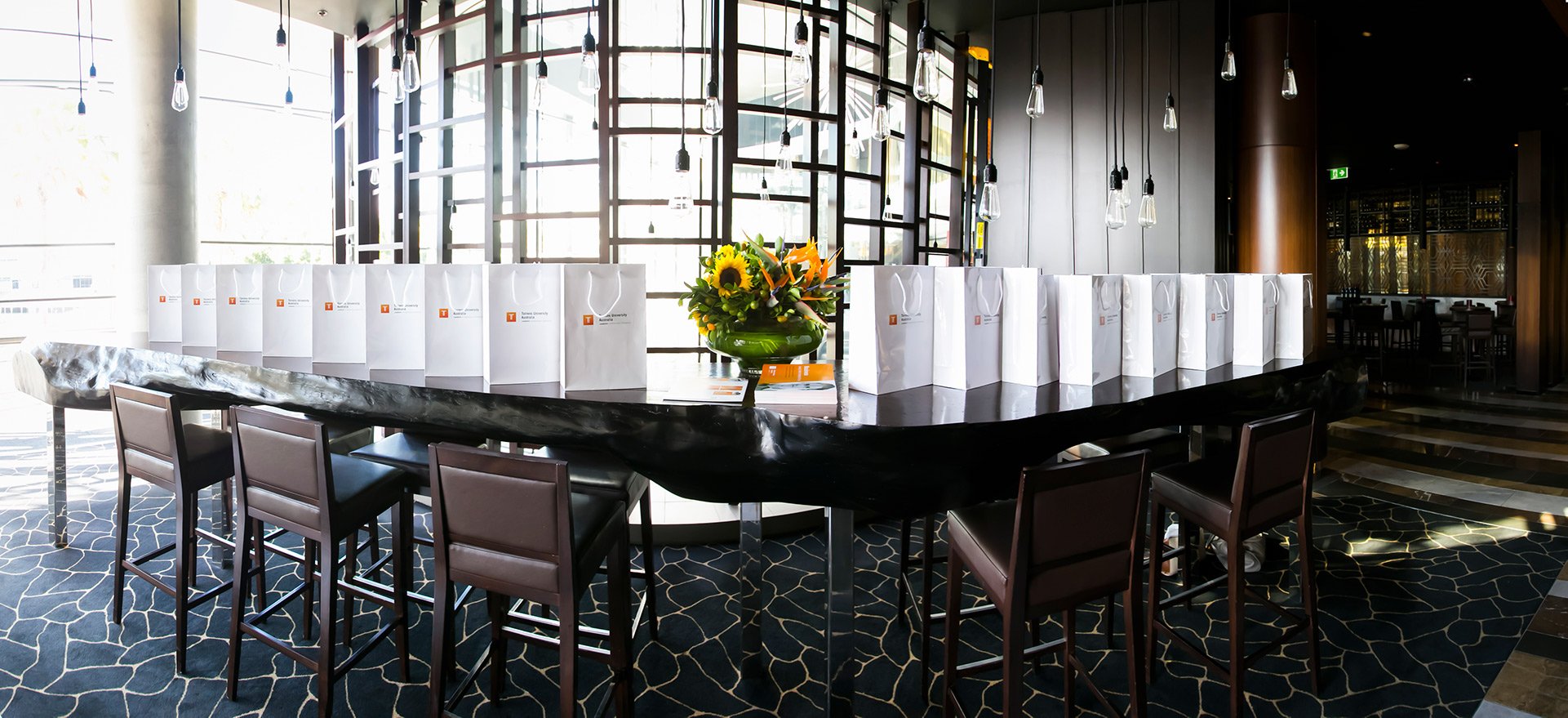  branded gift bags displayed on restaurant bar sydney kirsten cox photographer events 