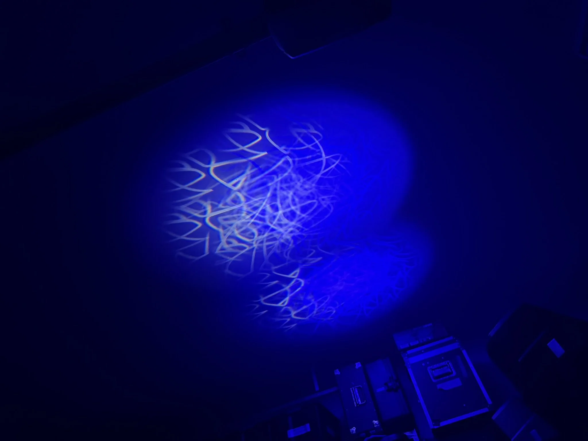 EK H1 moving head animation wheel creating flowing blue light textures in haze, available for professional lighting hire across the Sunshine Coast, Brisbane and Sydney.