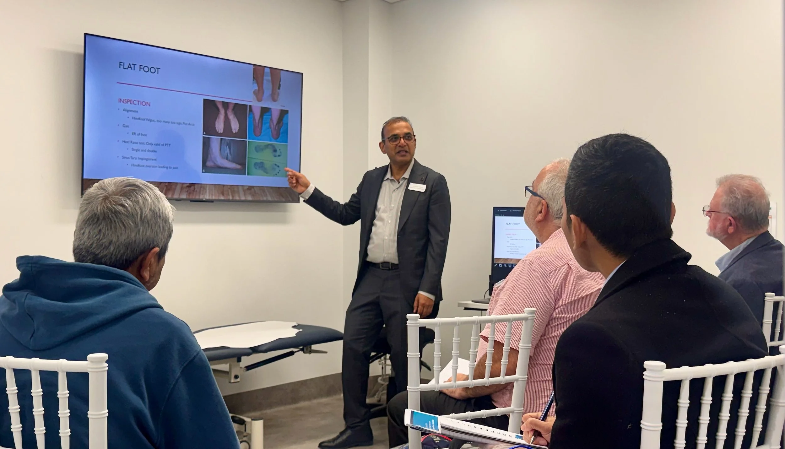 Dr Sheraz Anjum presenting to GPs during a Joint Vision foot and ankle education session