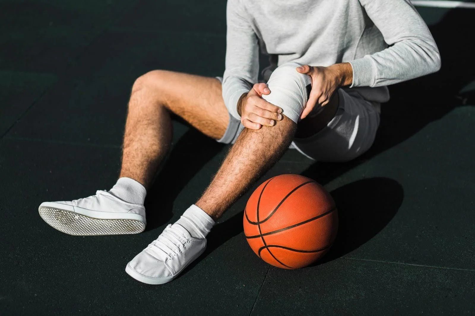 Preventative strapping on a basketballers knee to prevent a sporting injuries.jpg