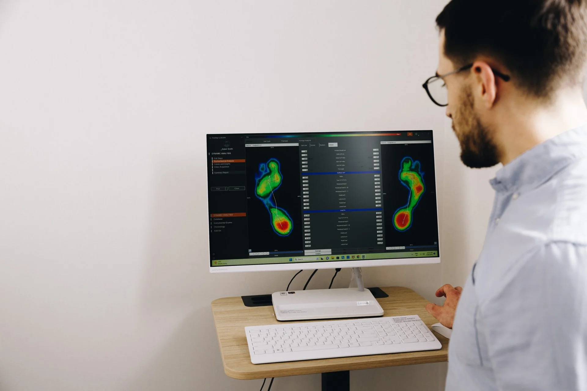 Steffan Evans, podiatrist at Joint Vision Orthopaedic Group in Wollongong, performing biomechanical gait analysis to assess foot mechanics and prescribe custom orthotics.