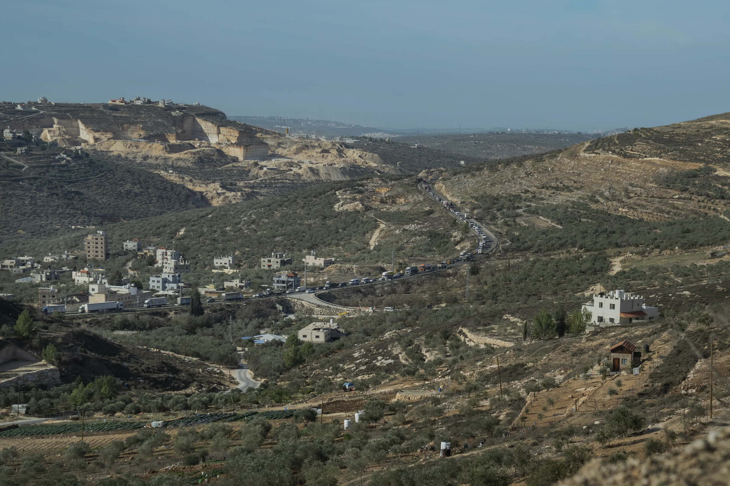 The road between Ramallah and Nablus becomes a long, motionless line of cars heading to a checkpoint — a familiar scene where workdays, court hearings and family visits dissolve in waiting.
West Bank - November 2025