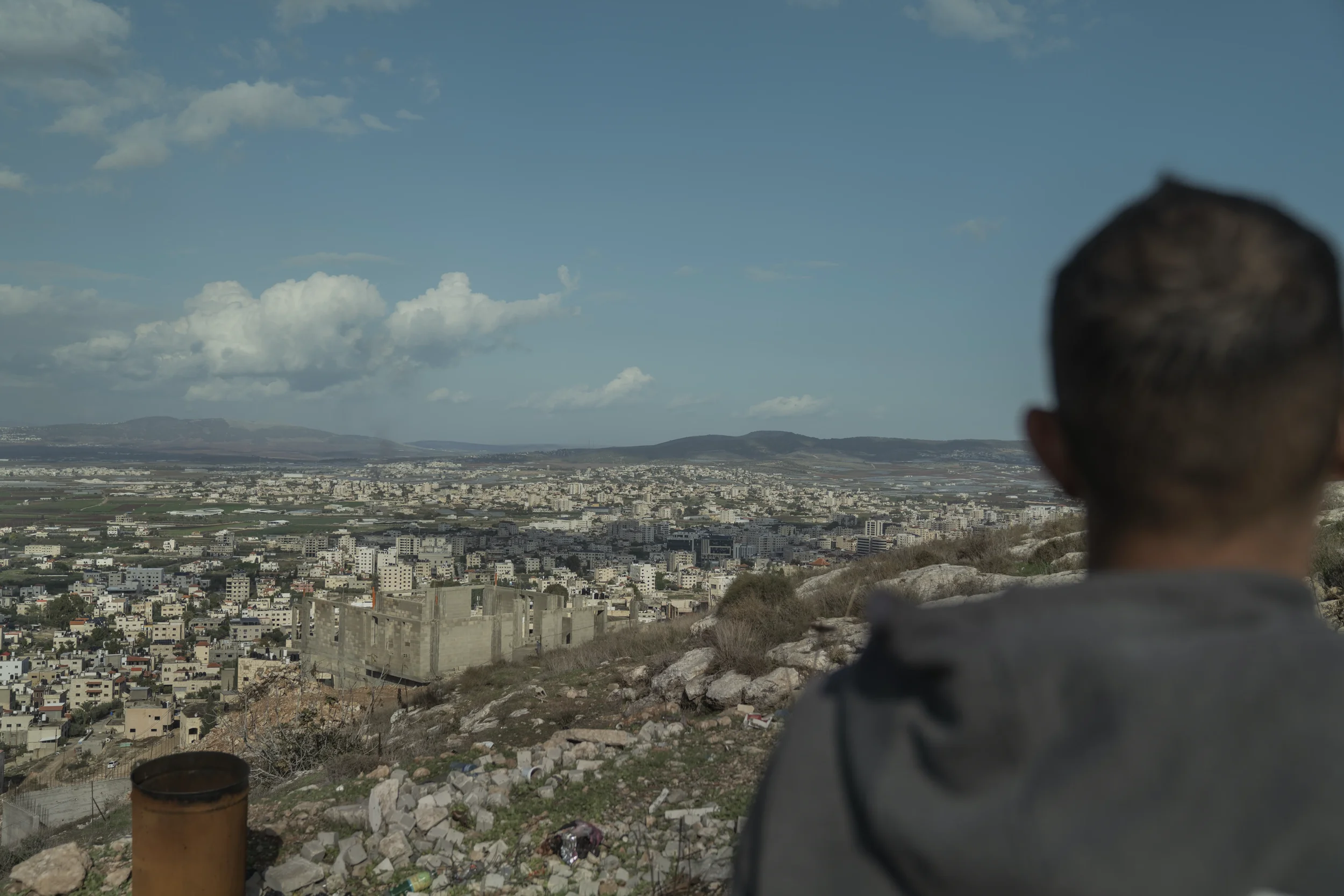 Osaid — a former taxi driver now working as a courier — looks out over the Jenin refugee camp, in a city where raids and military operations have become daily events.
Jenin - November 2025