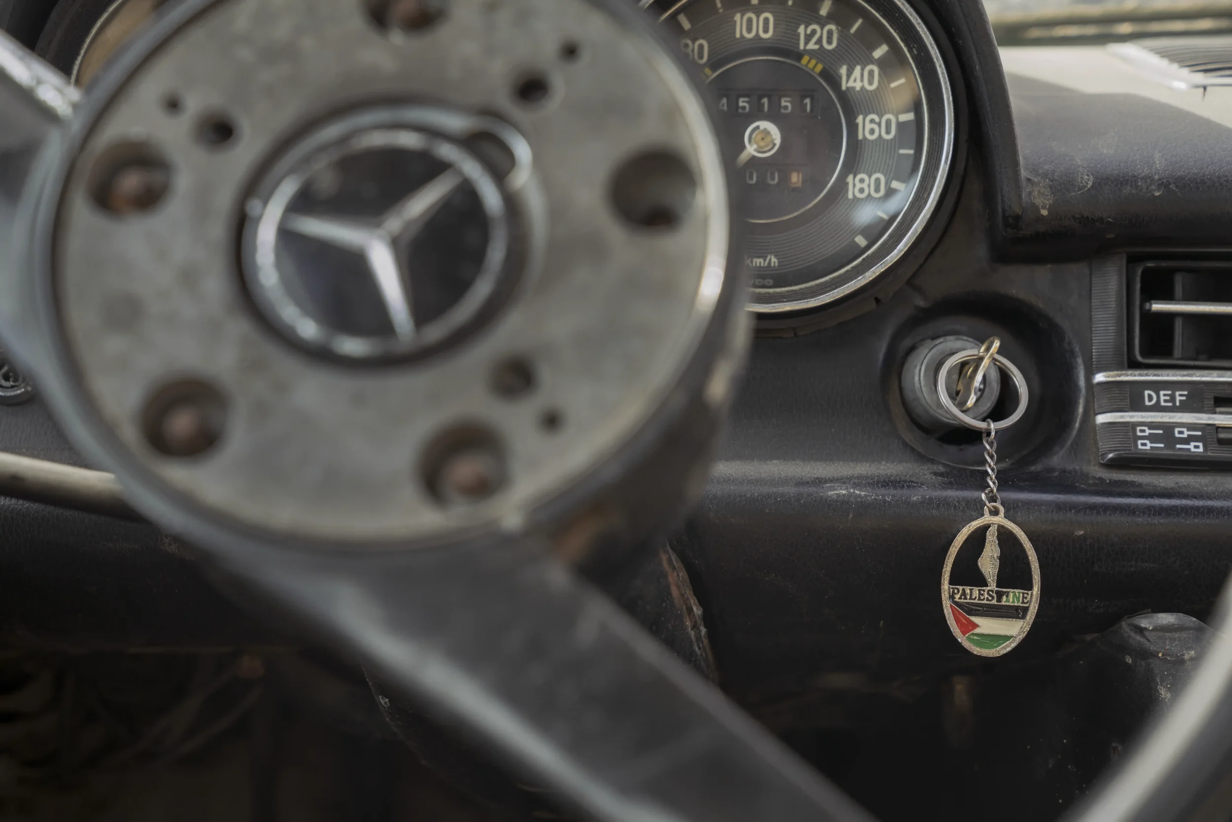 In Beit Furik, the car of Qassam, a young lawyer, shows a worn steering wheel and a key with the Palestinian flag — family memory and identity embedded in the everyday act of driving.
Beit Furik - December 2025