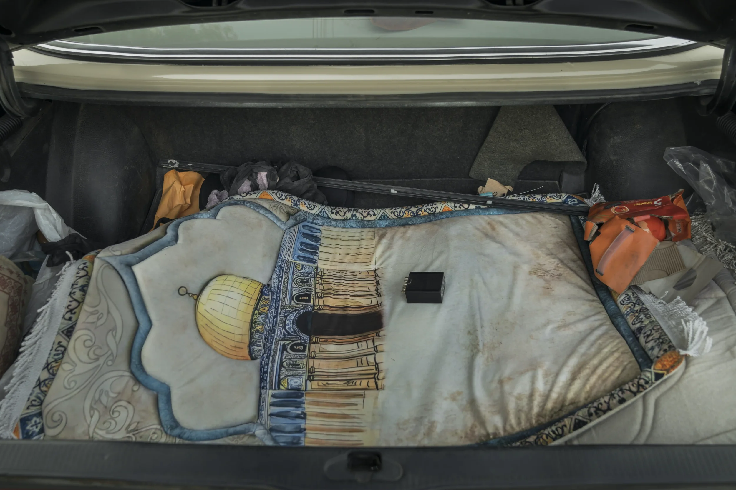 In the trunk, a prayer mat depicting the Dome of the Rock — a place many can no longer reach due to rare permits and unpredictable closures.
Ramallah - November 2025