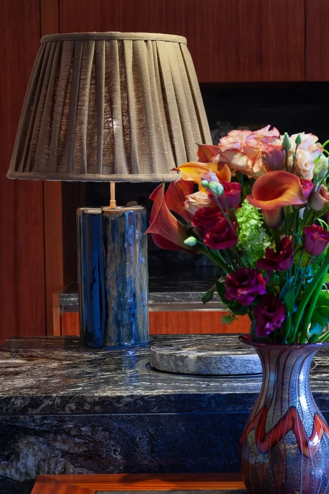 Isabelle Bizard Murano glass table lamp and Murano glass vase with a bouquet of roses and calla lilies, styled on a kitchen worktop, interior design photographer London