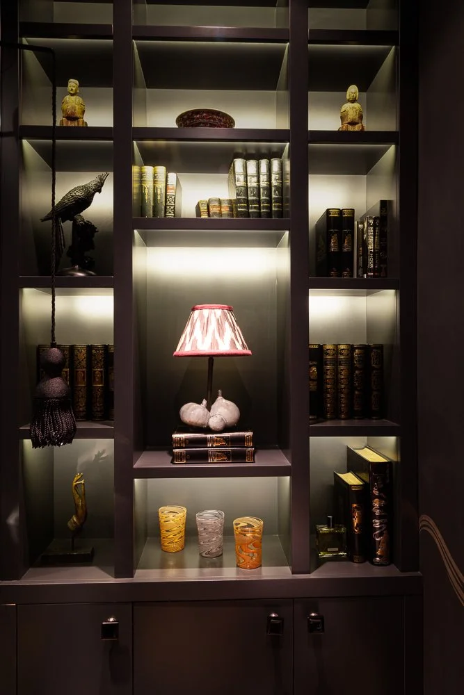 Isabelle Bizard table lamp and Murano glass tumblers, styled in a built-in bookshelf, interior design photographer