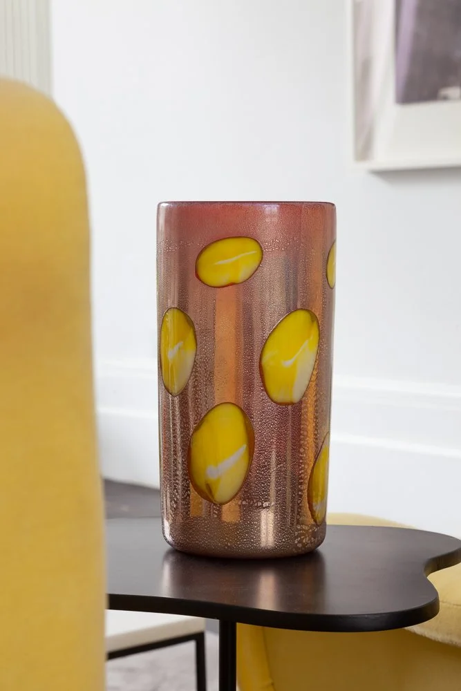Isabelle Bizard Murano glass vase with yellow accents, styled on a side table, interior photographer