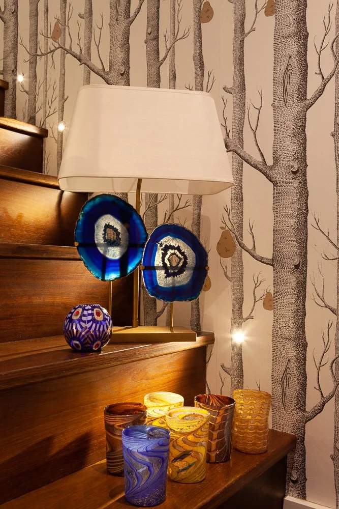 Isabelle Bizard Rio table lamp with blue agates, Murano glass tumblers and a blue Murano glass candle holder, interior photography