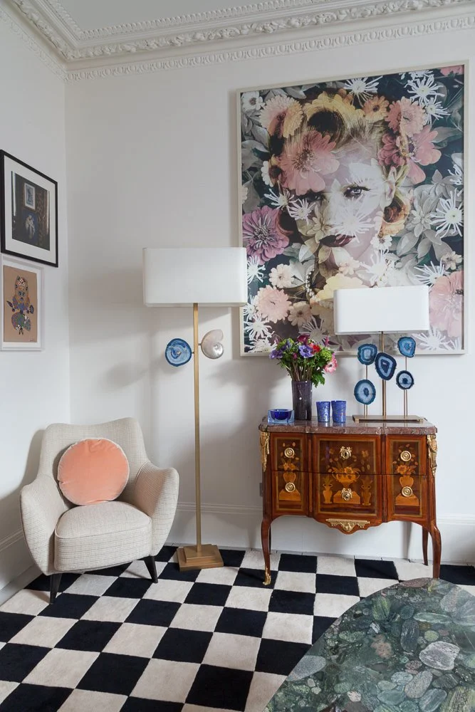 Isabelle Bizard Rio table lamp with blue agates and a floor lamp with blue agate and seashell detail, in a living room with a floral portrait, interior photographer London