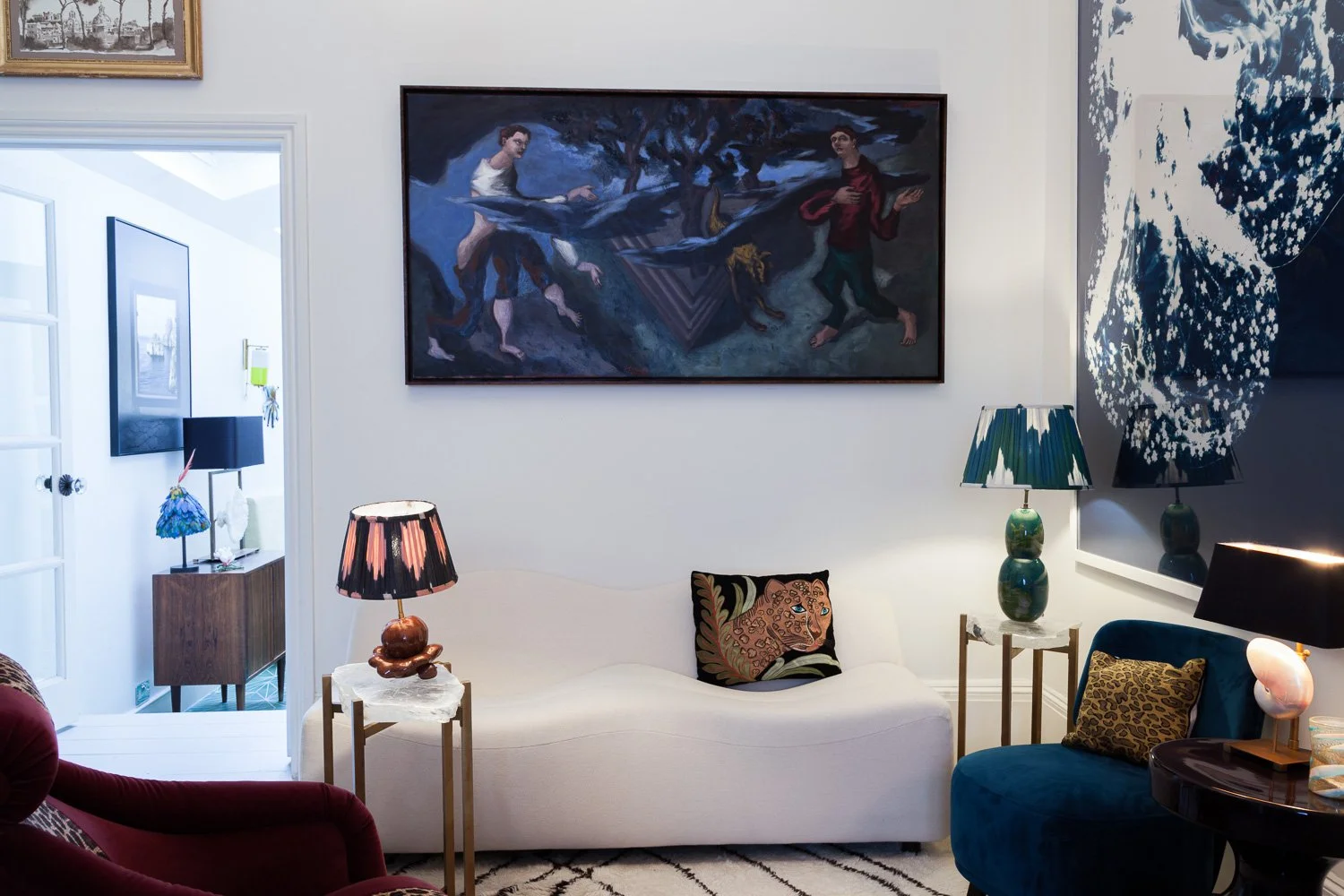 Isabelle Bizard table lamps including a Capri lamp with a nautile shell and a red vegetable lamp, styled in a living room, interior design photography