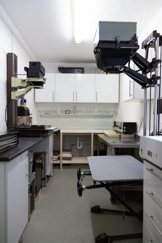 Photographic studio darkroom with enlargers and developing equipment, interior photography, Essex