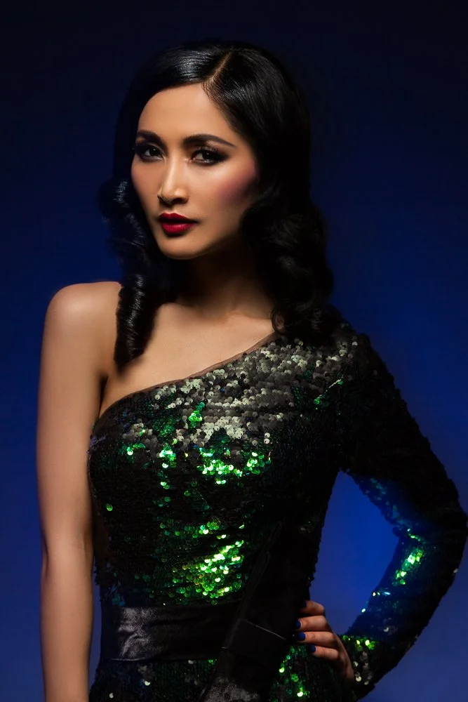 Close-up of a model in a one-shoulder sequin dress, styled and art directed by Laurence Trolet, fashion and editorial photography