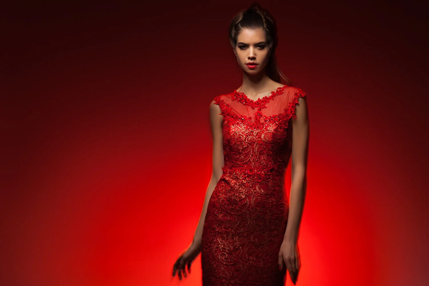 Model in a red sequin gown, full-length shot against dramatic red lighting, styled and art directed by Laurence Trolet, fashion and editorial photography