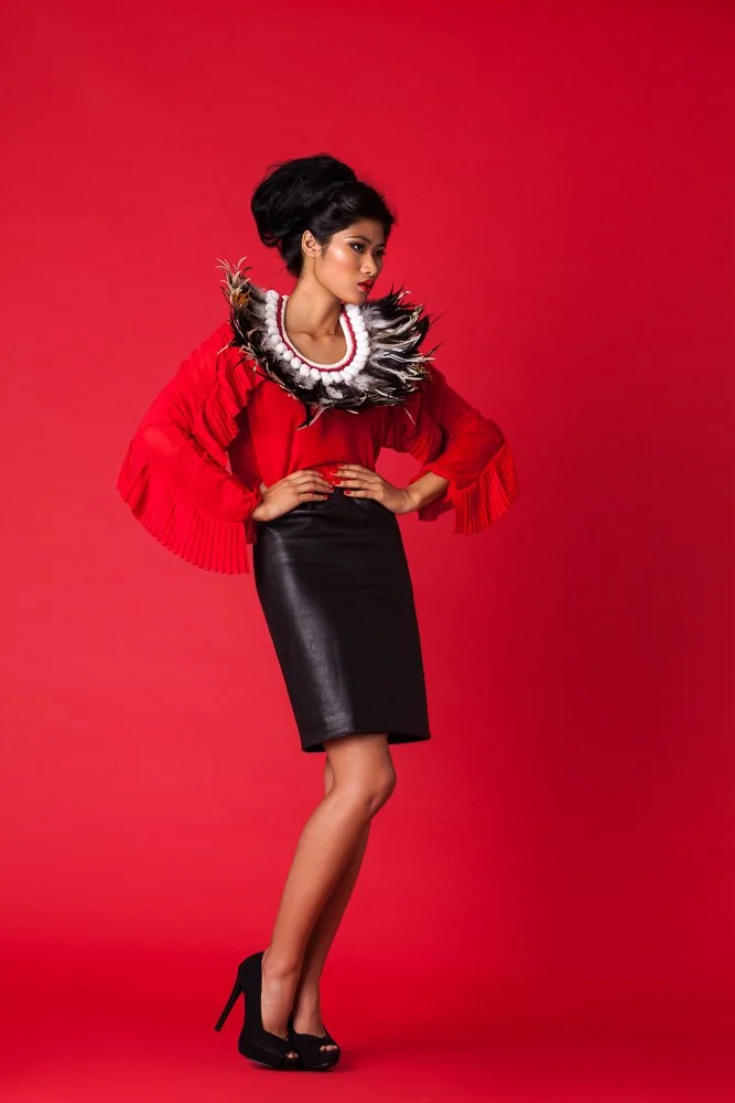 Model in a red ruffled top and black pencil skirt, styled and art directed by Laurence Trolet, editorial fashion photography