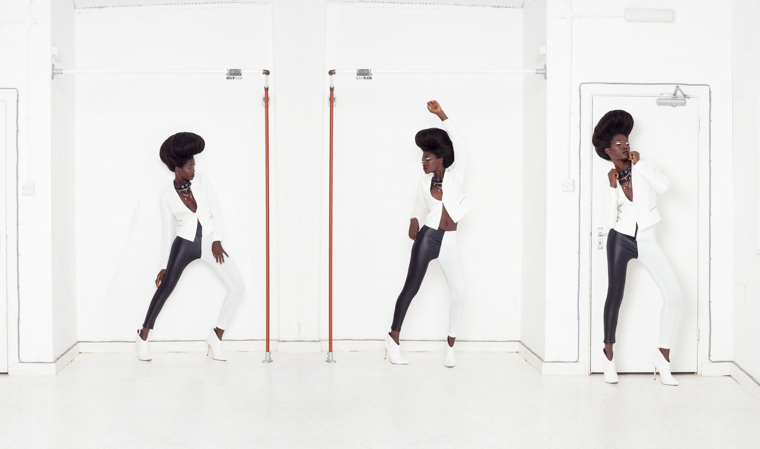 Sequence composite of one model in a monochrome tailored outfit, captured in three poses within a white studio, styled and art directed by Laurence Trolet, editorial photography