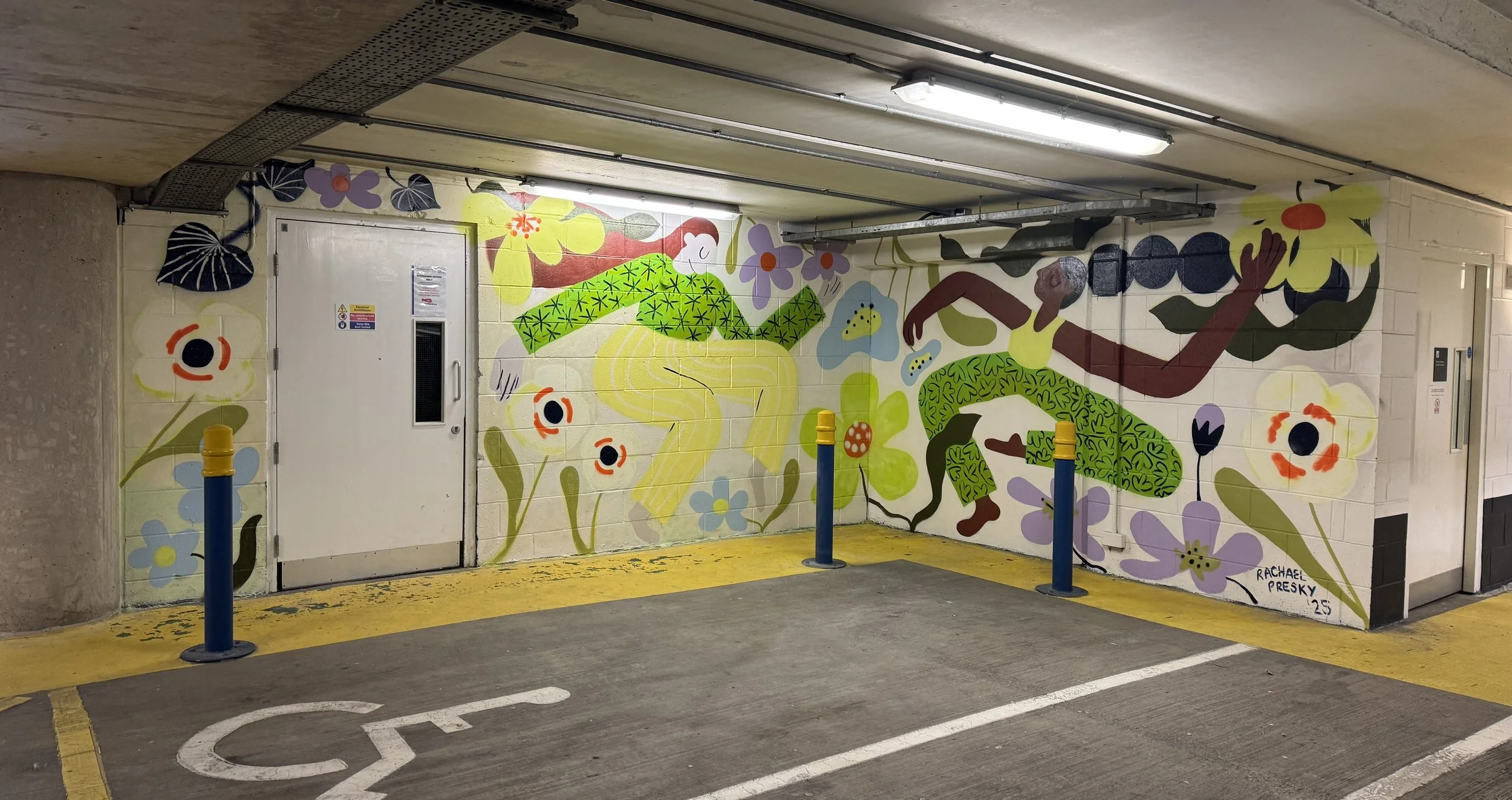 Colourful mural design around an awkward space and corner, two women dancing with flowers in spring colours around them