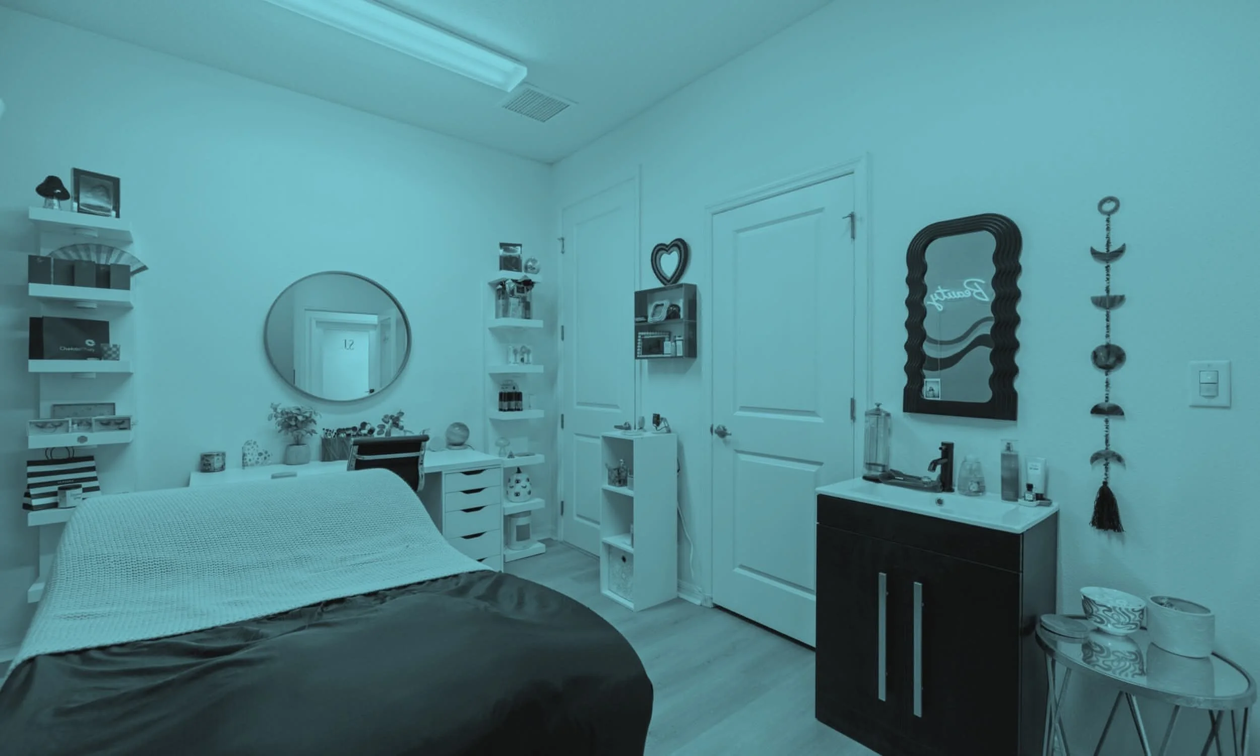 A bedroom with a bed, mirror, shelving, and various decor items on the walls and surfaces.