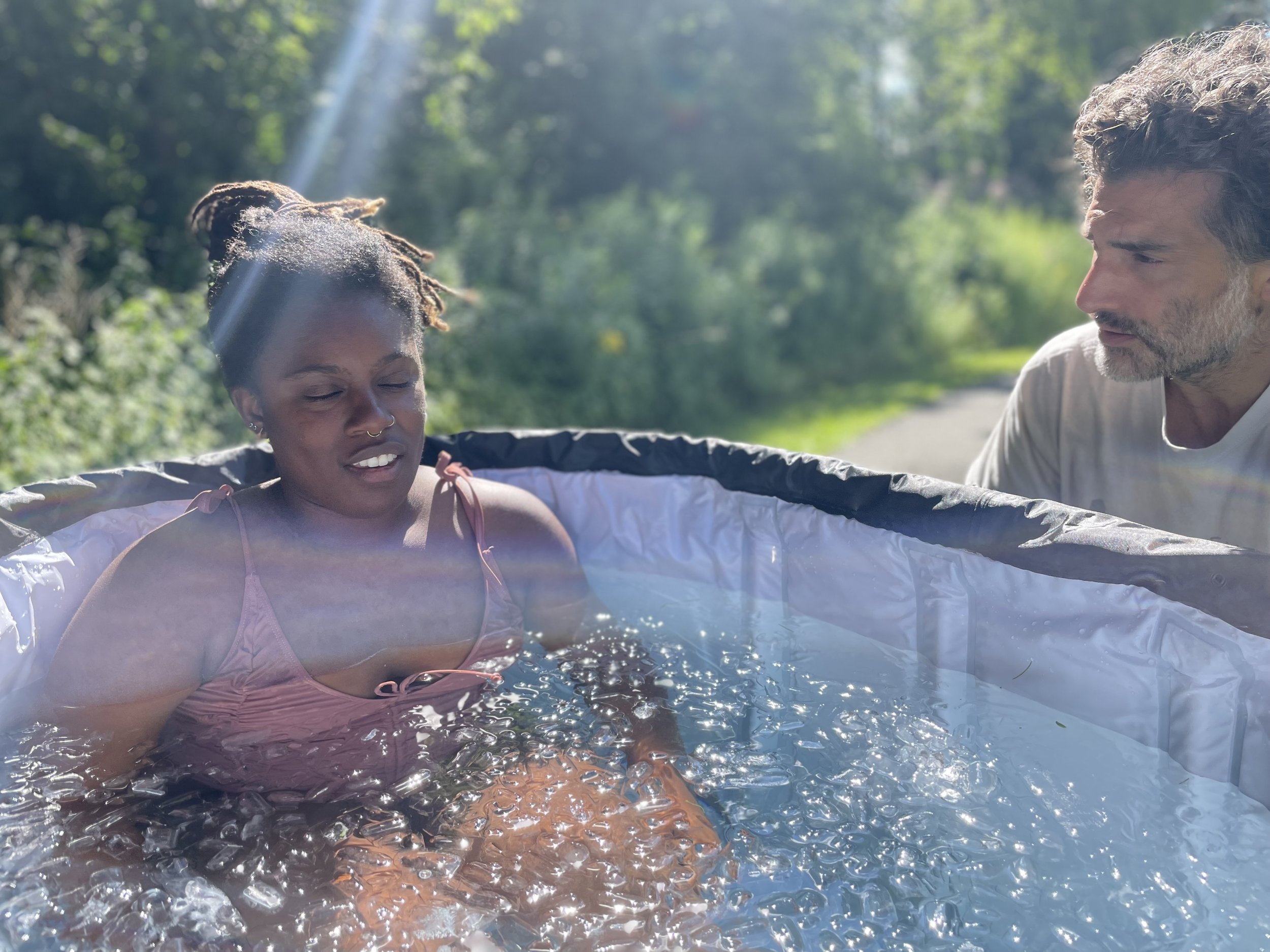 A participant in a guided cold immersion during a Terranuma session.